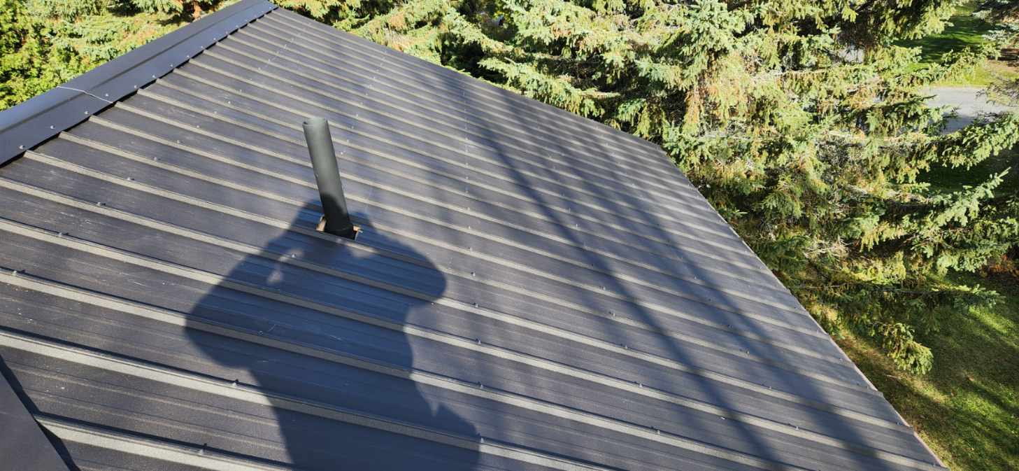 Finished metal roof project with black metal roofing panels